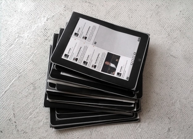 A pile of printed iPad mockups